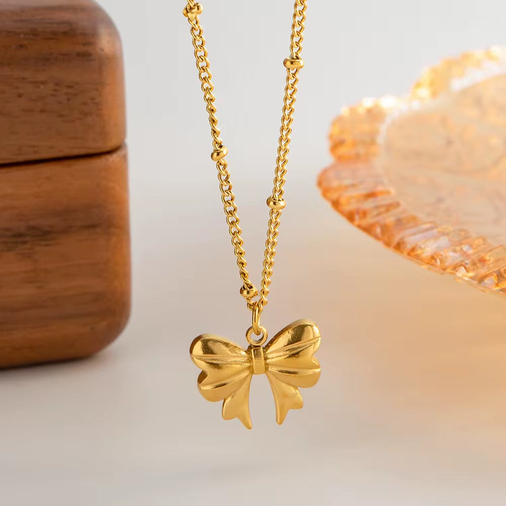 Gold Bow Charm Necklace